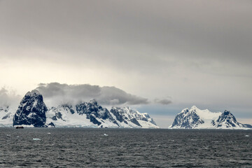 Fototapeta na wymiar Sailing between mountains in the Neumayer Channel in Antarctica