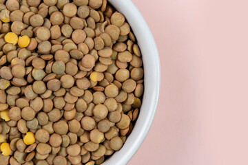 Lentils in bowl isolated with background. Top view. Flat lay.
