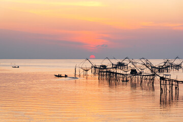 Scene of sunrise and tourist visiting giant fishing net