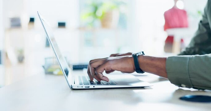 Black man is typing on laptop, hands and writing content for blog at digital agency, startup and productivity in office. Copywriting, keyboard and internet with workflow and male copywriter working