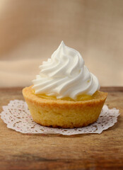 Yummy cupcake with lemon cream and meringue