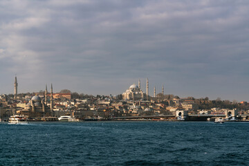 View of the Fatih district of Istanbul from the water of the Golden Horn Bay, Suleymaniye Mosque, New Mosque on a sunny day, Istanbul, Turkey