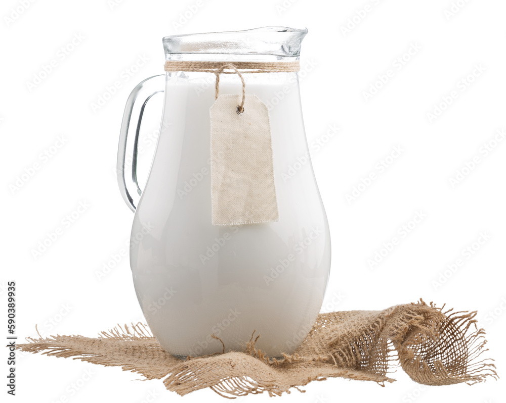 Sticker Fresh organic milk in glass and jug on rustic wooden table on nature background.