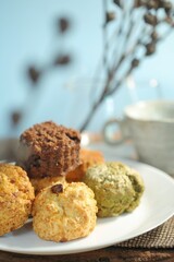 Delicious scone recipe serve with jam on the garden background. Selective focus and free space for text.