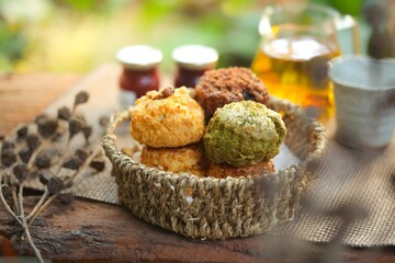 Delicious scone recipe serve with jam on the garden background. Selective focus and free space for text.