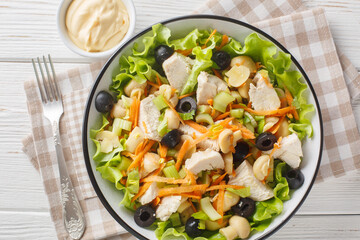 Piedmont Style Chicken Salad with vegetables and mushrooms close-up in a bowl on the table. Horizontal top view from above