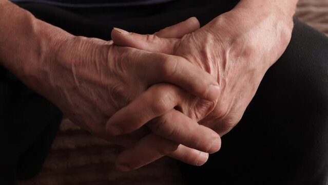 Close-up Of Folded Wrinkled Pensioner. Pensive Elderly Man. Old Man's Hands. Selective Focus.the Concept Of The Elderly