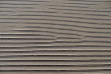 Photo texture, sandy bottom with drawings from the waves, the Baltic Sea.