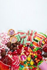 Various sweets assortment. Candy, bonbon, chocholate on white background.