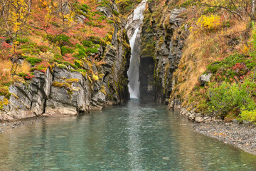 Flowing water in autumn. Abisko national park in north of Sweden.