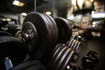 Fototapeta premium Close up detail shots of weights in an old school bodybuilding gym