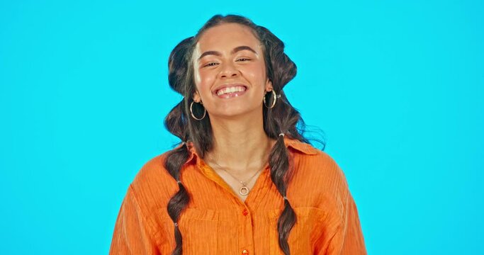 Happiness, celebration and success, woman on studio backdrop with mockup space, winning and achievement. Excited gen z model, smile and happy girl winner with goal emoji, victory and blue background.
