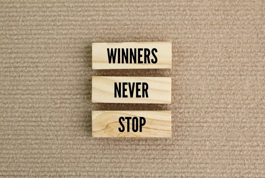 sticks arranged with the word Winner never stops. the concept of not giving up. the concept of self-motivation. positive vibes