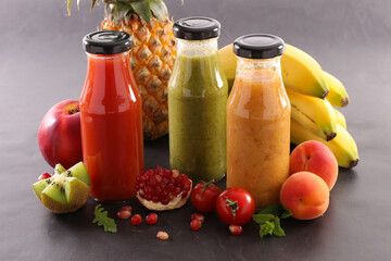 Fruit juice in bottle and fresh fruits