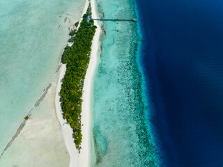 Top view of atoll and tropical island Mataking with beach. Tun Sakaran Marine Park. Borneo, Sabah,...