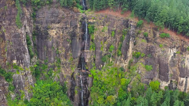 A tropical waterfall in the jungles of Sri Lanka. Bambarakanda Falls. Sri Lanka.