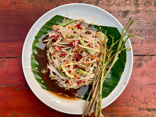 Papaya Salad with Vermicelli, Salted Crab and Fermented Fish, Famous Northeastern food in Thailand.