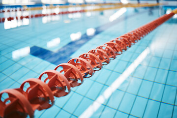 Water, empty swimming pool and lanes for competition, exercise and workout. Sports, swim and fitness with lane ropes or divider in liquid for aquatic training, exercising or underwater practice. - Powered by Adobe