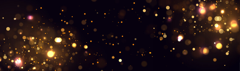Fototapeta na wymiar Golden abstract bokeh on black background. Christmas or holiday card decoration