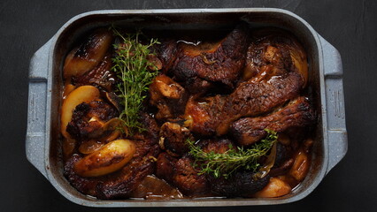 A steak braised herbs, served with boiled  potatoes garnished with fresh oregano.