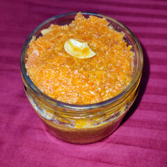 selective focus picture of indian dessert food: carrot halwa or gajar ka halwa