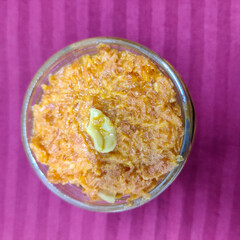 selective focus picture of indian dessert food: carrot halwa or gajar ka halwa