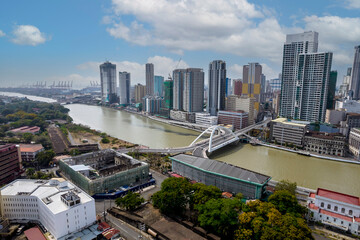 Fototapeta premium Manila, Philippines - Aerial of the Binondo skyline and the Pasig river traversed by the Binondo - Intramuros Bridge.