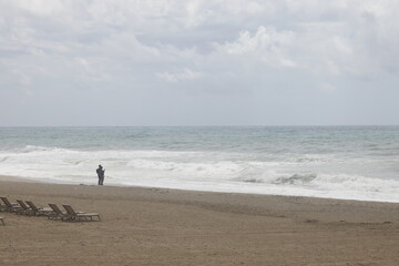 Fototapeta na wymiar Storm on the beach on a cloudy day, minimalism, Alanya, Turkey, April 2023.
