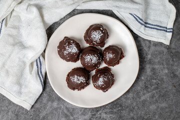 Coconut and chocolate chip cookies..Bakery products. Cookies with tea on dark background. Top view