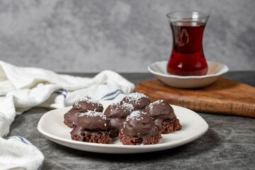 Coconut and chocolate chip cookies..Bakery products. Cookies with tea on dark background