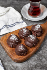 Coconut and chocolate chip cookies..Bakery products. Cookies with tea on dark background. Close up