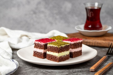 Small cake slices. Pistachio and raspberry cake slices. Set of different tartlets or cakes. Bakery products