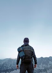 Man on top of the mountain.