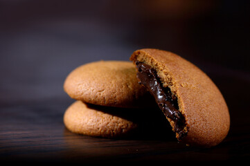 Biscuits filled with chocolate cream. Chocolate cream cookies. brown chocolate biscuits with cream...