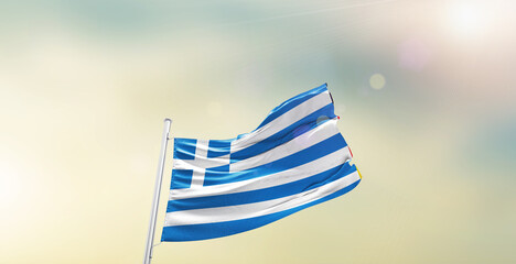 Waving Flag of Greece on blur sky. The symbol of the state on wavy cotton fabric.