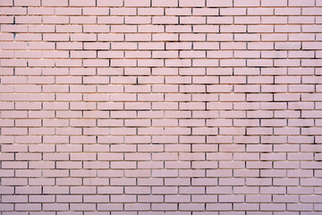 Empty brickwall background texture. Brickwork with row of pink color brick. Copy space