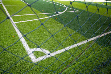 Corner lines in artificial turf football fields In the perspective viewed from the outside through...