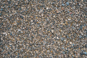 Round pebble texture background. Pebble sea beach close up, dark round pebbles and gray dry pebbles, high quality photo idea for screen