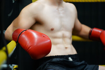 Muay Thai, The martial art of Thailand, Boxer sitting in the corner When the referee stops the...