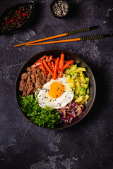 Traditional Korean dish Bibimbap: rice with vegetables beef and egg.