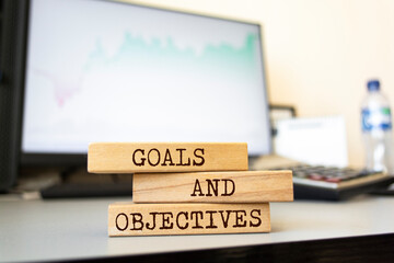 Wooden blocks with words 'Goals and Objectives'. Business concept