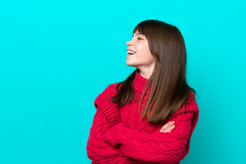Fototapeta premium Little caucasian girl isolated on blue background happy and smiling
