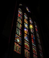 Vertical shot of a colorful stained glass window