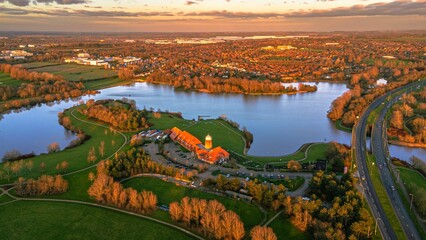 Aerial view of Caldecotte lake and its surroundings on a beautiful autumn evening