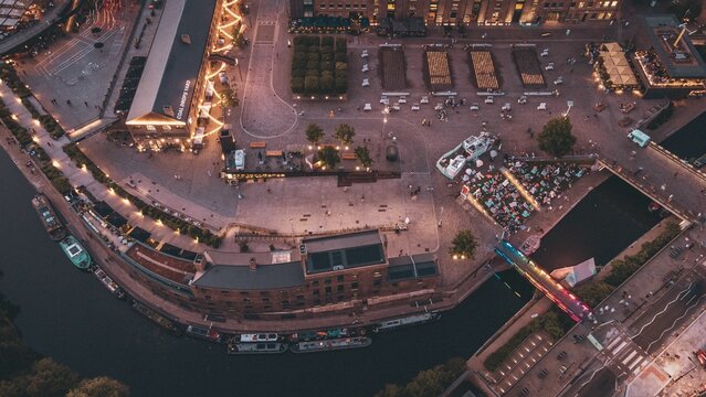 Aerial shot of the canal with boats in Granary Square City park in London