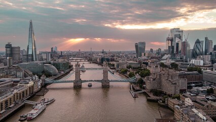 An aerial shot of the Tower Bridge over river Thames at sunset