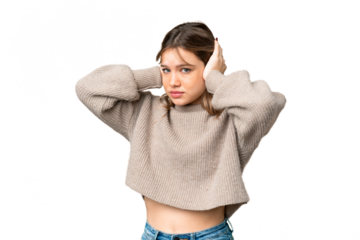 Young girl over isolated chroma key background frustrated and covering ears
