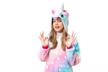 Young girl with unicorn pajamas over isolated chroma key background showing an ok sign with fingers