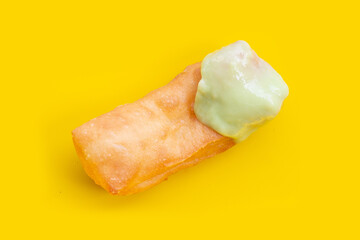 Deep-fried dough sticks or chinese bread sticks with with pandan custard dip