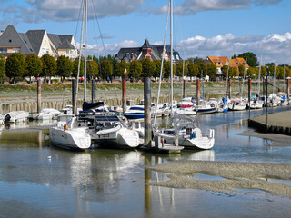 Fototapeta na wymiar Port of Le Crotoy at low tide, a commune in the Somme department in Hauts-de-France in northern France 
